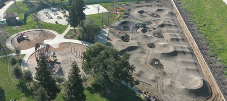 Aerial view of park with pump track construction
