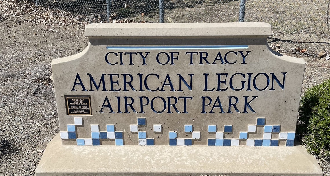 Stone park entrance sign engraved with 
