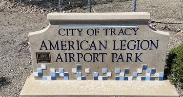 Stone park entrance sign engraved with 