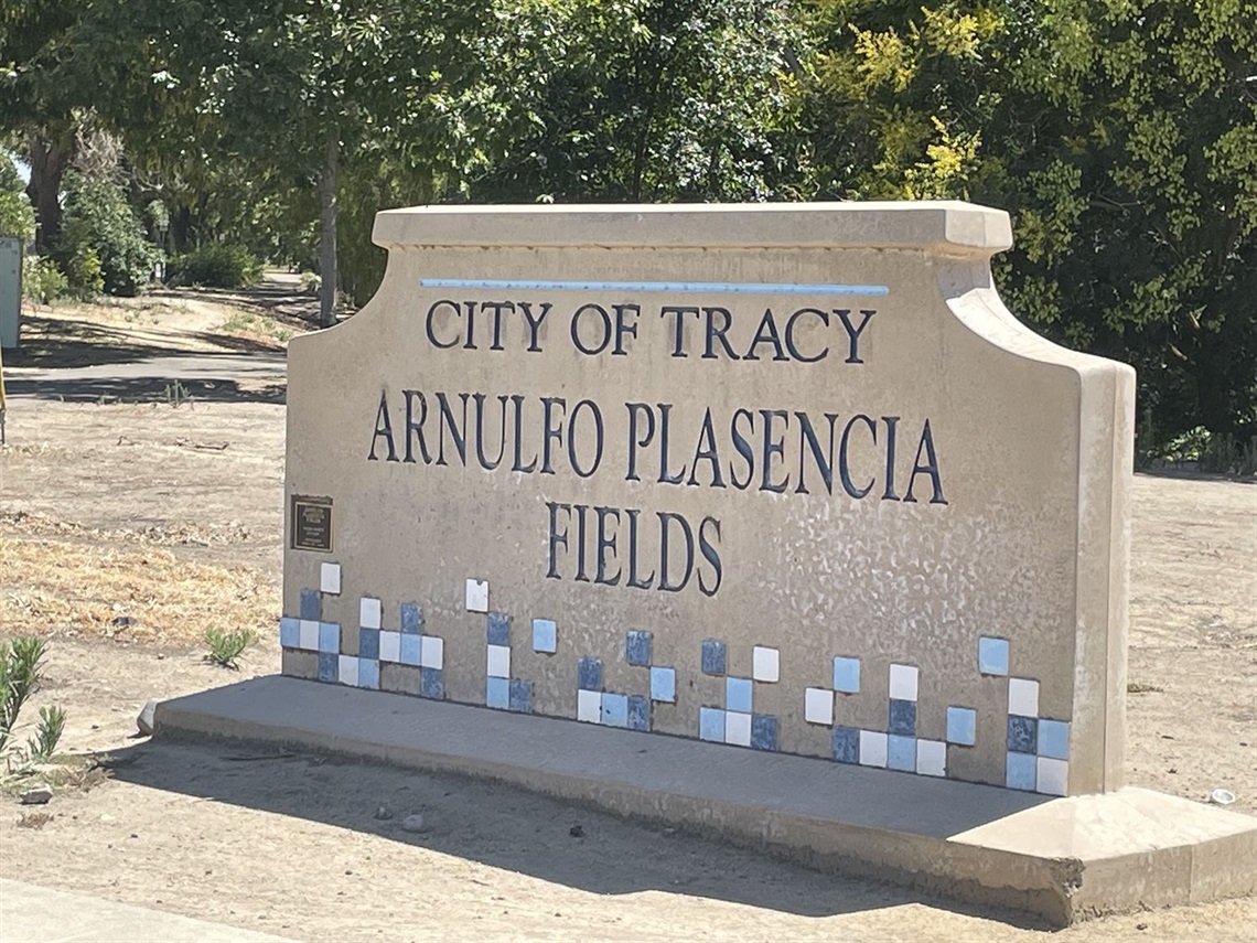 Stone entrance sign engraved with 