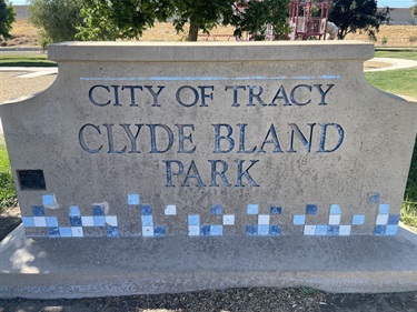 Stone park entrance sign engraved with 
