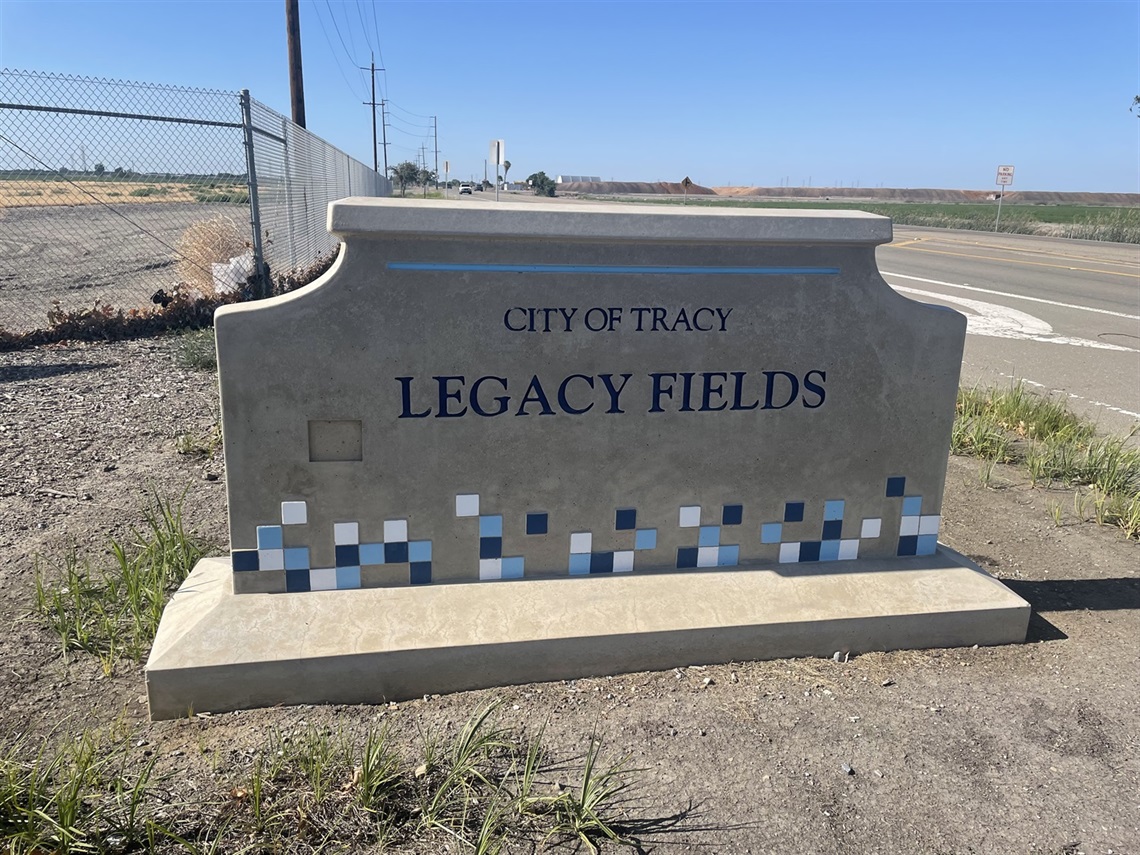 Stone entrance sign engraved with 
