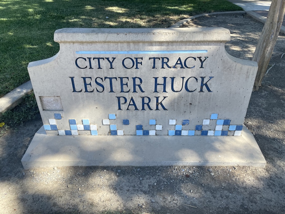 Stone park entrance sign reading 