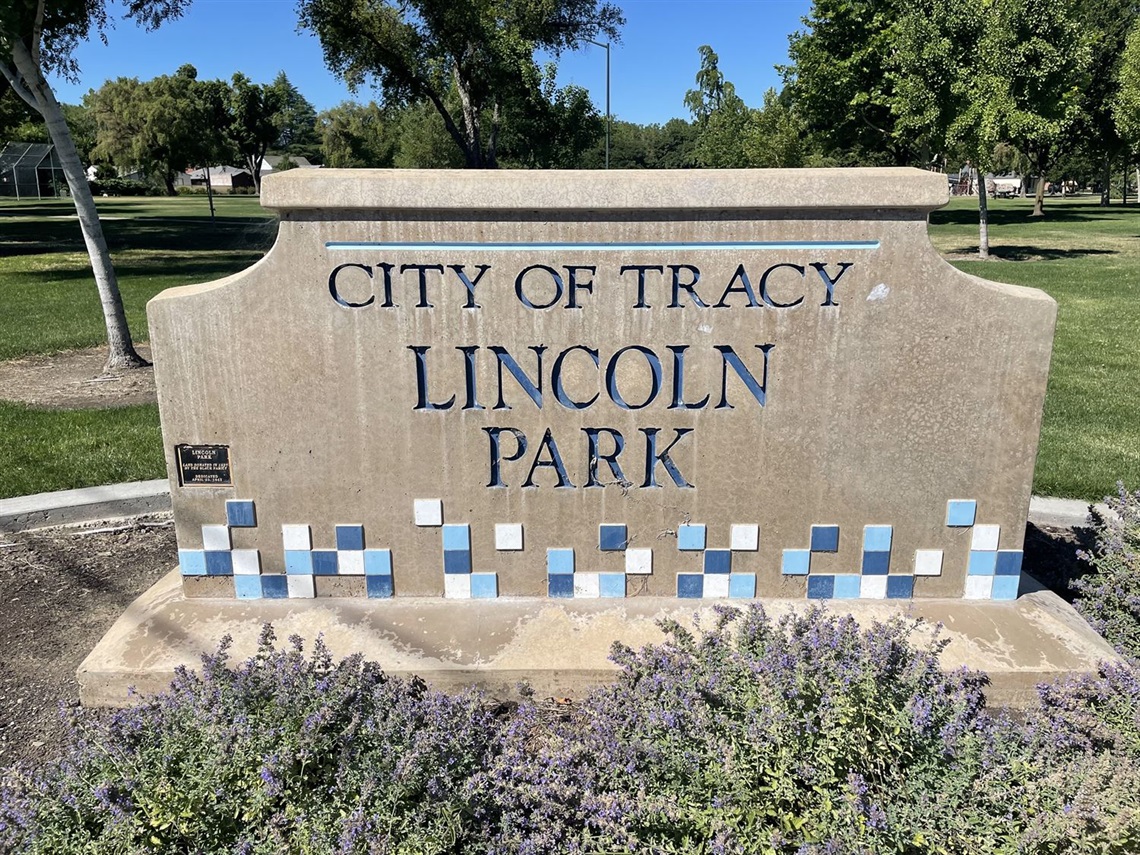 Stone park entrance sign engraved with 