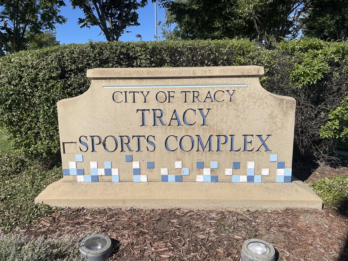 Stone entrance sign engraved with 