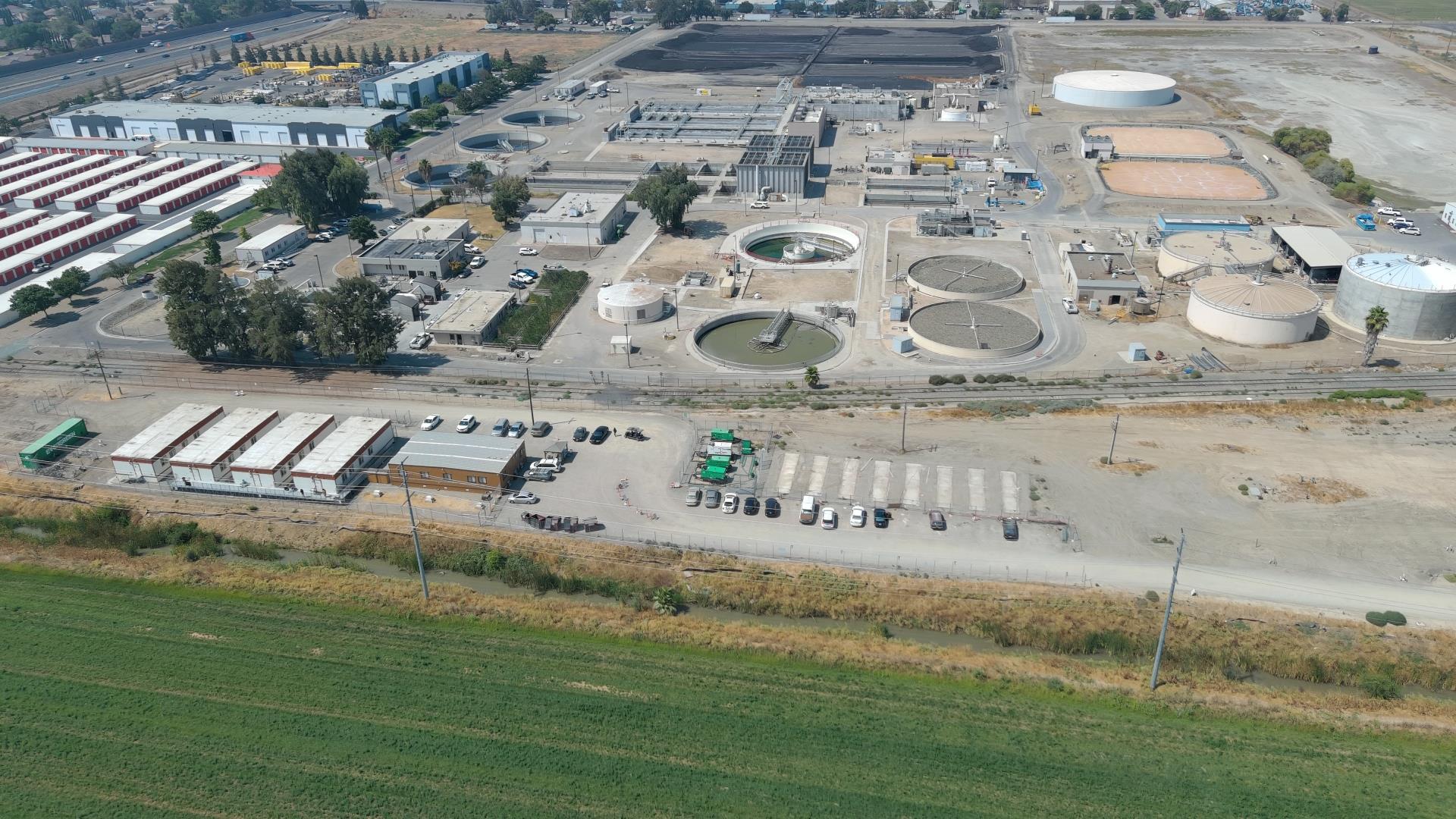 Aerial view of Phase III Site with buildings, and parking areas