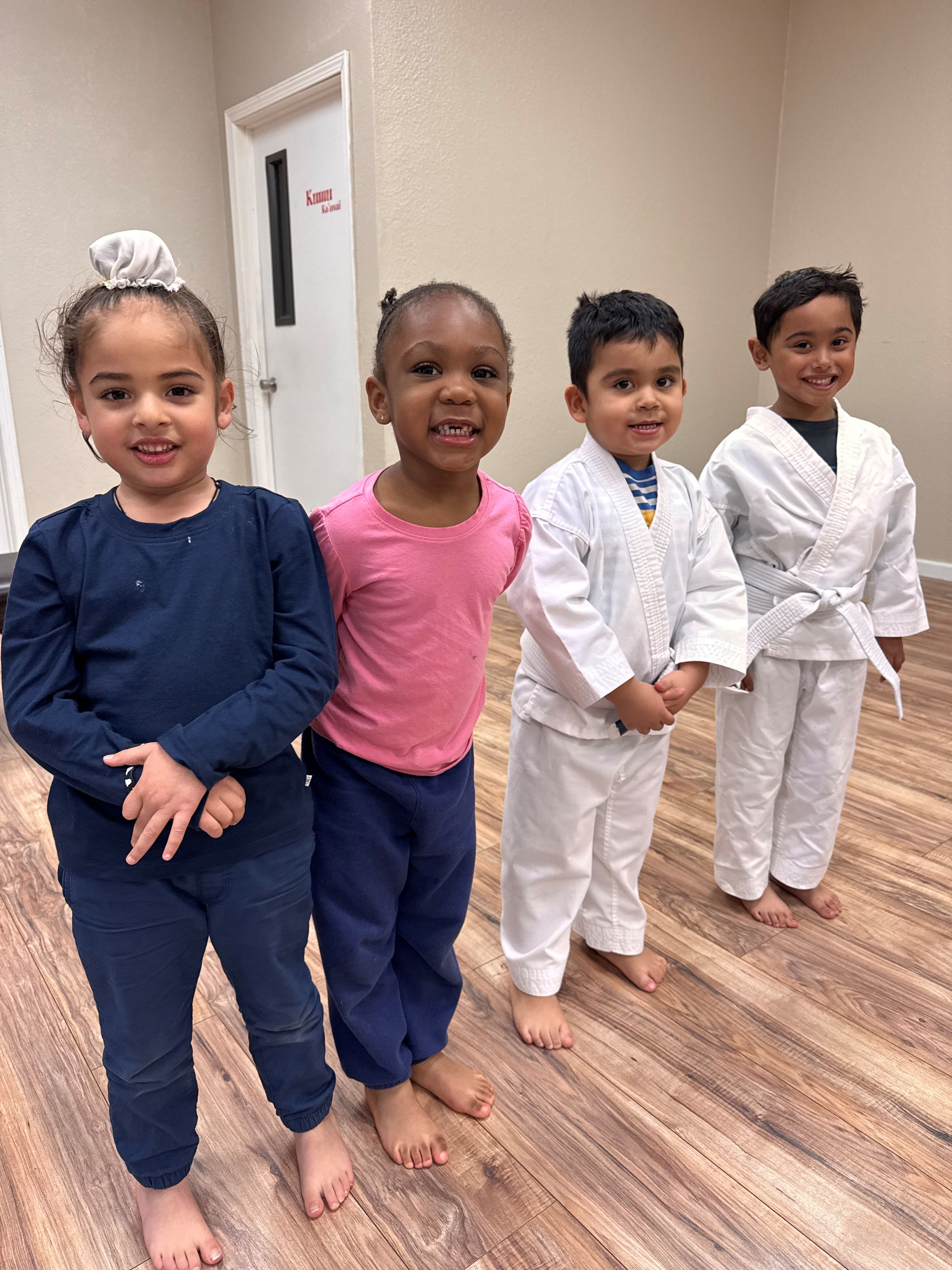 Group of 4 kids posing for Tiny Tots Martial Arts Class